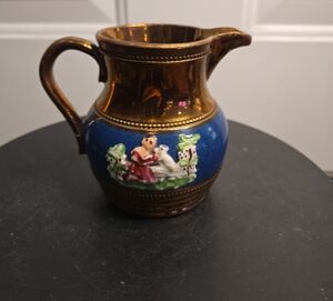 Antique Ceramic Pitcher with Blue and Brown Design